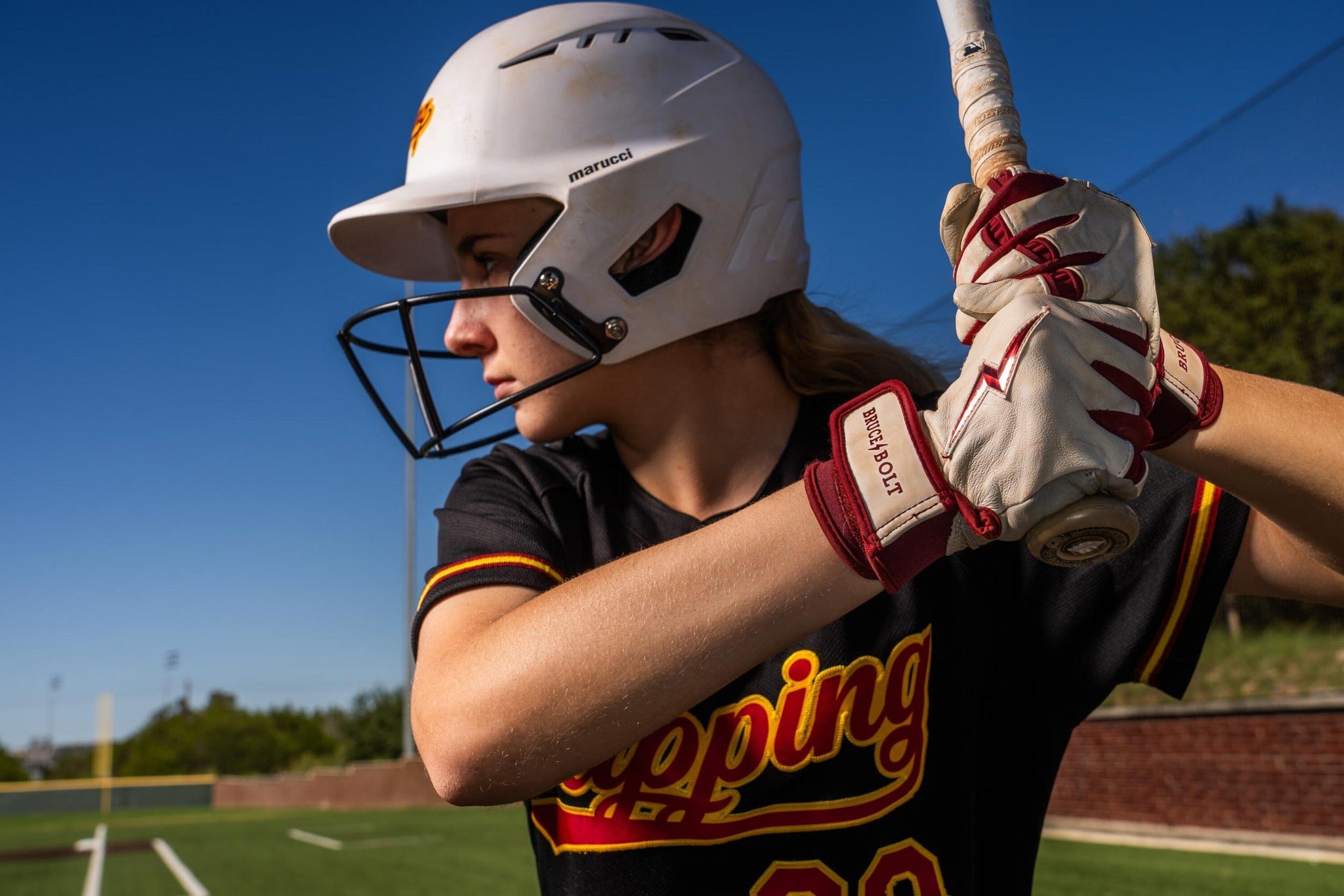 Picture of girl holding a baseball bat.