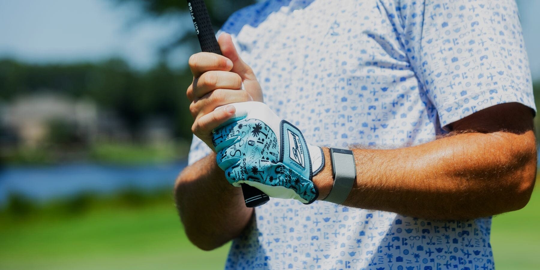 Person holding a golf club.