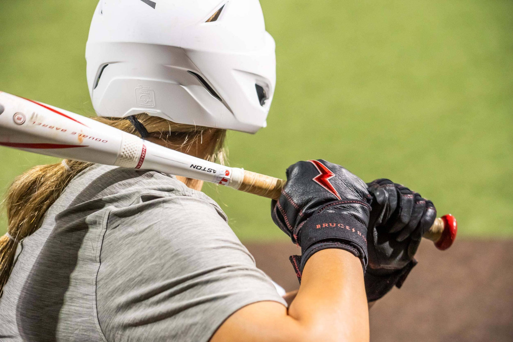 Image of a girl holding a softball bat.