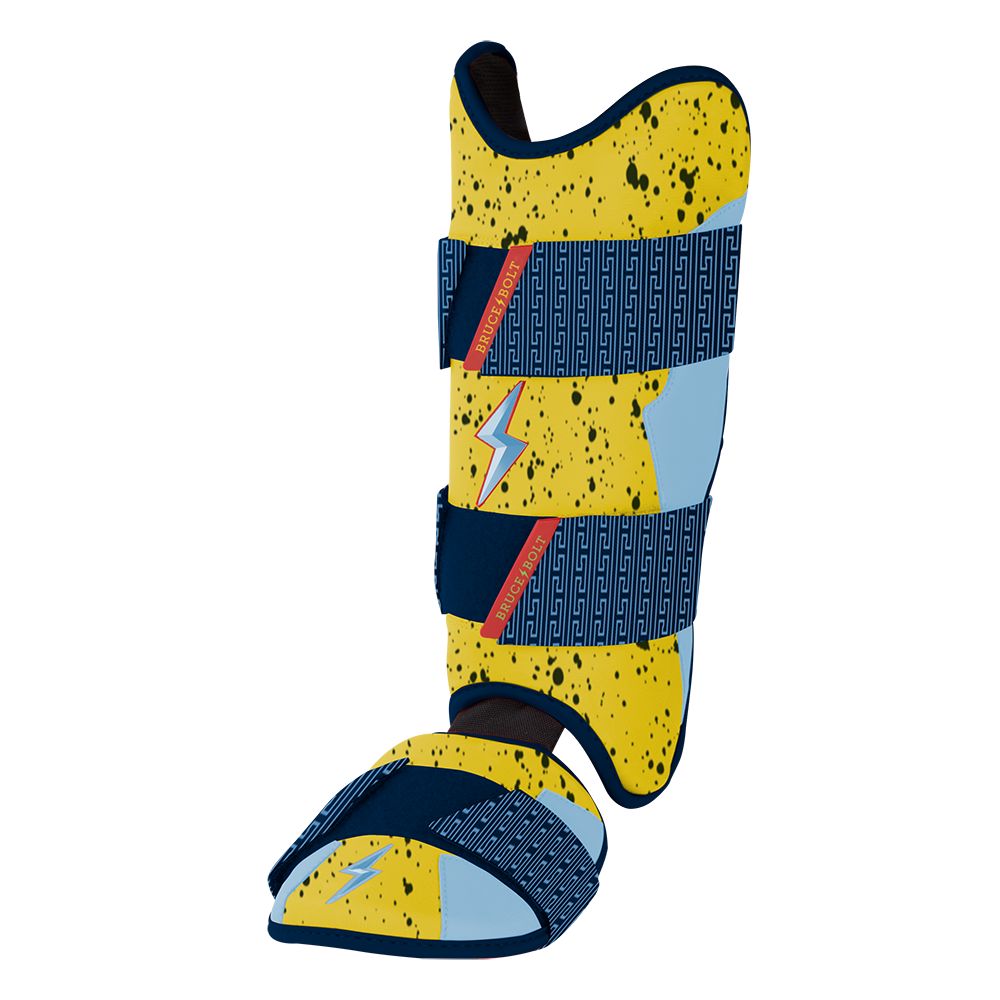 Yellow and blue baseball leg and ankle guard with a speckled pattern and lightning bolt accents.