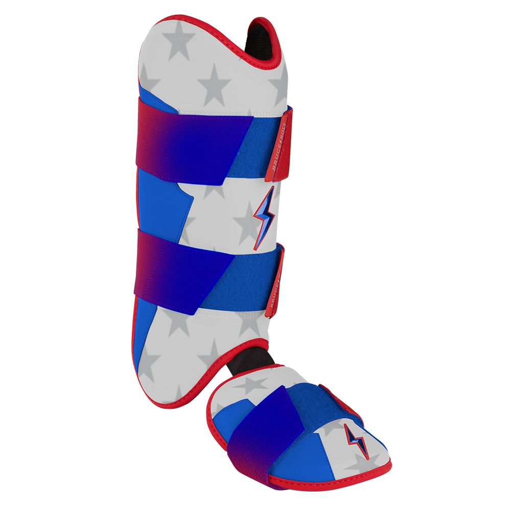 Red, white, and blue baseball leg and ankle guard with a star pattern and lightning bolt accents.
