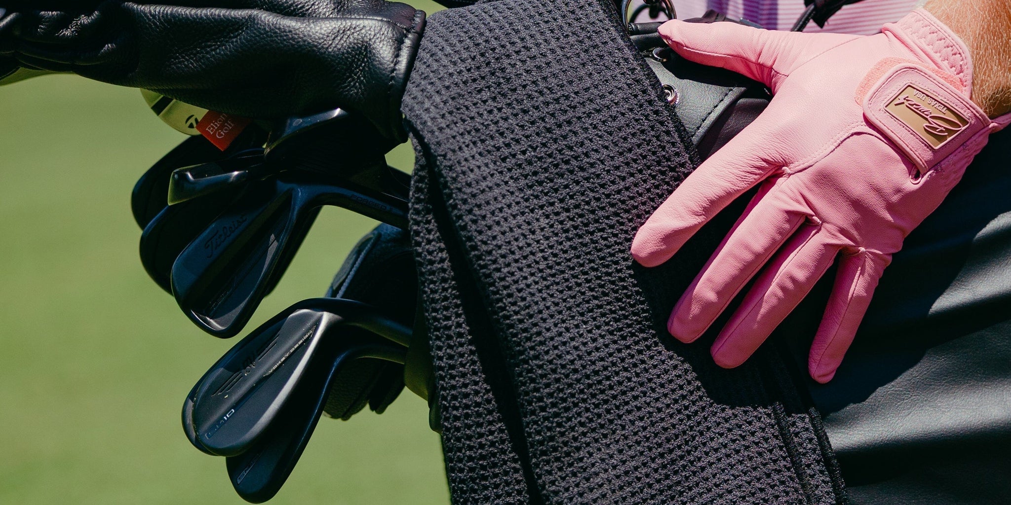 Golf bag with golf clubs.