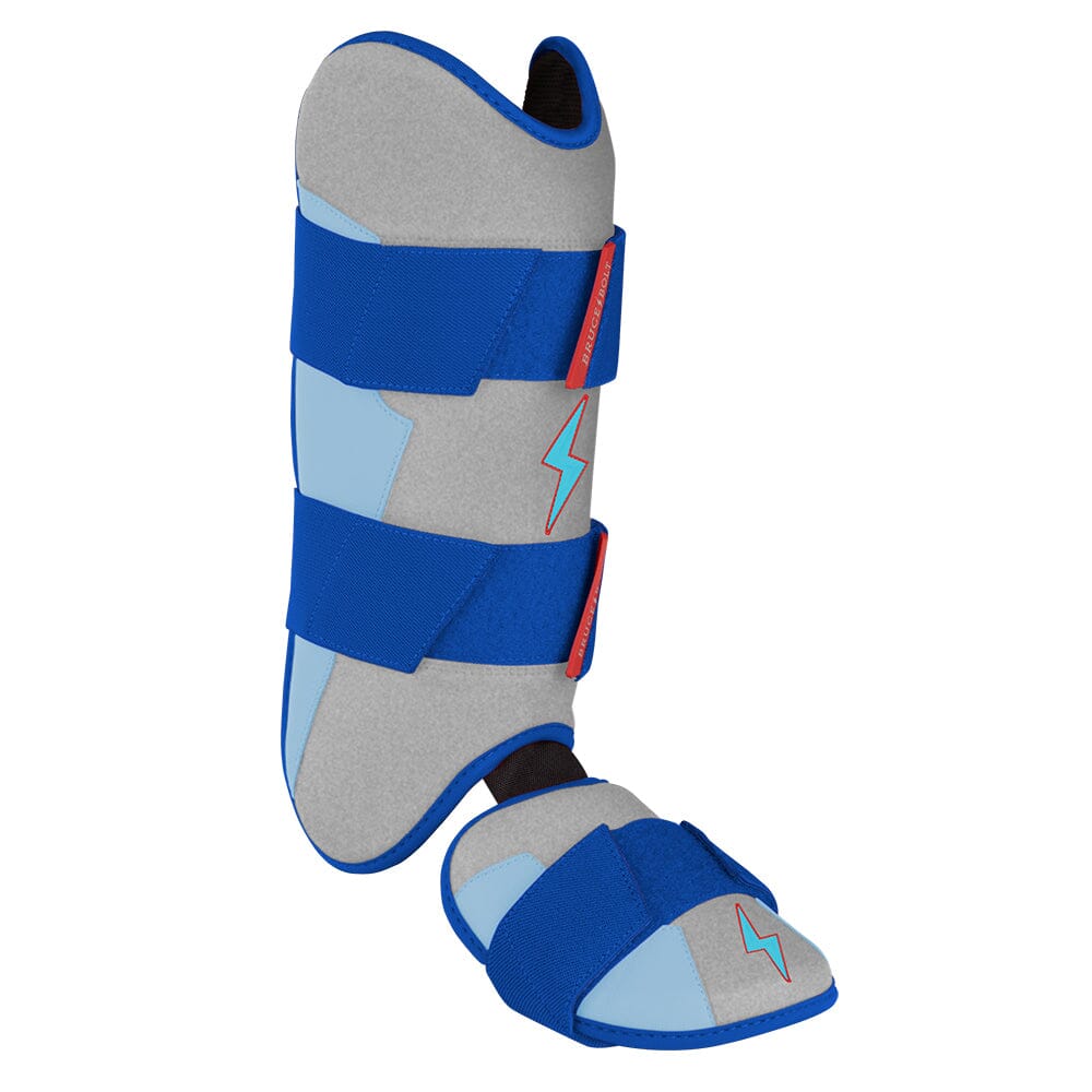 Silver and blue baseball leg and ankle guard with blue straps and lightning bolt logo.