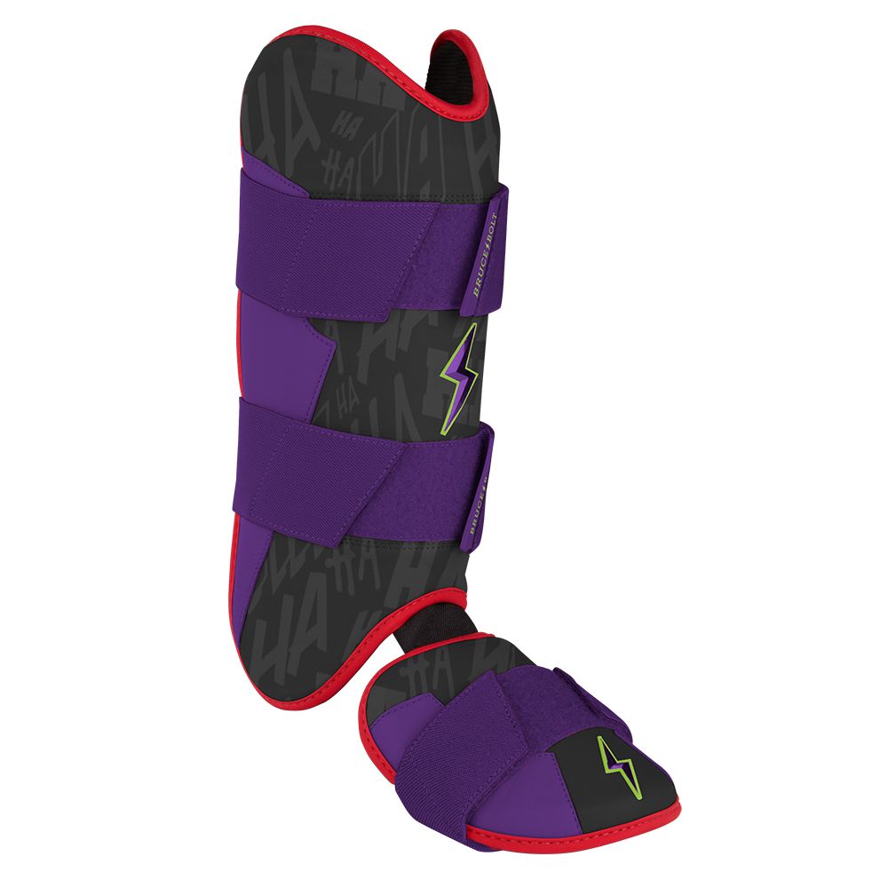 Black, purple, and red baseball leg and ankle guard with a subtle text pattern and green lightning bolt logo.