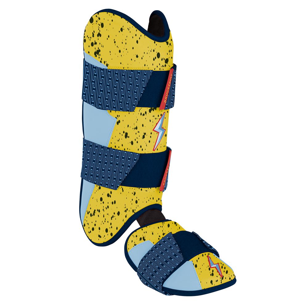 Yellow, blue, and black speckled batter leg guard with blue straps and lightning bolt accents.