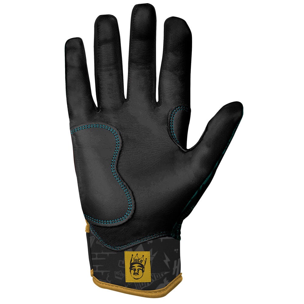 Black athletic batting glove with teal stitching and gold wrist cuff featuring a logo.