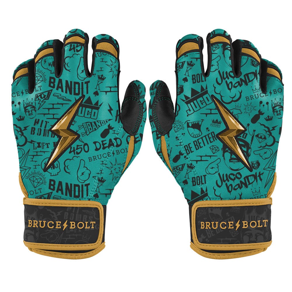 Mint green and gold short cuff batting gloves with graffiti patterns and gold lightning bolts.