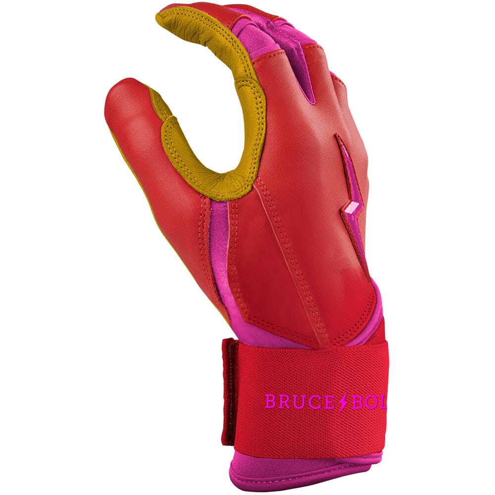 Pink and red long cuff batting glove with yellow palm and branding on the wrist strap.
